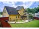 View of the backyard with a patio and well-maintained lawn. Includes access to the home at 452 Emerald Trce, Jonesboro, GA 30236