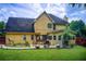 View of the backyard with a patio and well-maintained lawn. Includes access to the home at 452 Emerald Trce, Jonesboro, GA 30236