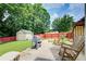 Spacious backyard with a shed, patio, and plenty of room to relax and entertain at 452 Emerald Trce, Jonesboro, GA 30236