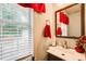 Bright and airy bathroom with modern fixtures, clean lines, and natural light from a window at 452 Emerald Trce, Jonesboro, GA 30236