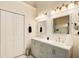 Bathroom featuring double sinks, a white countertop, and a large mirror at 452 Emerald Trce, Jonesboro, GA 30236