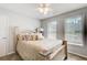 Comfortable bedroom features a ceiling fan and natural light from windows at 452 Emerald Trce, Jonesboro, GA 30236
