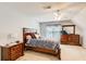Bedroom with plush bedding, a ceiling fan, and wooden dressers at 452 Emerald Trce, Jonesboro, GA 30236