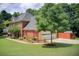 Charming two-story brick home featuring an attached garage and a beautifully landscaped front yard at 452 Emerald Trce, Jonesboro, GA 30236