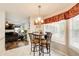 Eat-in kitchen features a breakfast nook with a view of the adjacent living room at 452 Emerald Trce, Jonesboro, GA 30236