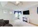 A comfortable living room with a tray ceiling, and a mounted television at 452 Emerald Trce, Jonesboro, GA 30236