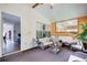 Cozy sunroom with seating, a mirror accent, and a view of the backyard at 452 Emerald Trce, Jonesboro, GA 30236
