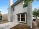 Rear view of the home featuring vinyl siding, a patio, and well-maintained landscaping at 4817 Enclave Dr, Union City, GA 30291