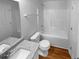 Clean bathroom featuring a shower-tub combo and a granite-topped vanity sink at 4817 Enclave Dr, Union City, GA 30291