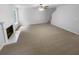 Spacious living room with neutral carpet and a white fireplace at 4817 Enclave Dr, Union City, GA 30291