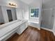 Beautiful bathroom featuring a large soaking tub, glass shower, and dual vanities at 4817 Enclave Dr, Union City, GA 30291