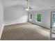 Main bedroom featuring vaulted ceilings, neutral carpet, and lots of natural light at 4817 Enclave Dr, Union City, GA 30291