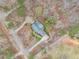 Aerial view of the house surrounded by trees at 4150 E Chapel Hill Rd, Douglasville, GA 30135