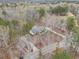 Aerial view showing the house and surrounding woodlands at 4150 E Chapel Hill Rd, Douglasville, GA 30135
