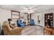 Finished basement with seating, wood-look floors, and built-in shelving at 4150 E Chapel Hill Rd, Douglasville, GA 30135
