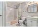 Bright bathroom featuring a shower-tub combo, white vanity, and ample lighting at 4150 E Chapel Hill Rd, Douglasville, GA 30135