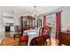 Charming dining room with hardwood floors and classic furnishings, creating an inviting space for Gathering meals and entertaining at 4150 E Chapel Hill Rd, Douglasville, GA 30135
