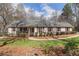 Charming front exterior with a porch and well-maintained landscaping at 4150 E Chapel Hill Rd, Douglasville, GA 30135