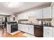 Updated kitchen with granite countertops, black appliances and tiled backsplash at 4150 E Chapel Hill Rd, Douglasville, GA 30135