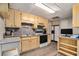 Kitchen with wood cabinets, stainless steel appliances, and wood-look floors at 4150 E Chapel Hill Rd, Douglasville, GA 30135