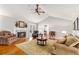 Spacious living room featuring hardwood floors, a cozy fireplace, and tasteful decor, ideal for relaxing and entertaining at 4150 E Chapel Hill Rd, Douglasville, GA 30135