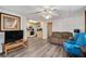 Living area with hardwood floors, a comfortable sofa, and adjacent kitchen at 4150 E Chapel Hill Rd, Douglasville, GA 30135