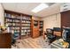 Home office with large bookshelves and two desks, ideal for productivity at 4150 E Chapel Hill Rd, Douglasville, GA 30135