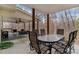 Covered back patio with a large dining table perfect for outdoor gatherings at 4150 E Chapel Hill Rd, Douglasville, GA 30135