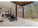 Expansive covered back patio overlooking a private backyard with wooded views at 4150 E Chapel Hill Rd, Douglasville, GA 30135