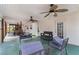 Covered back porch with ceiling fans, comfortable seating, and a relaxing atmosphere at 4150 E Chapel Hill Rd, Douglasville, GA 30135