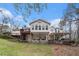 Rear of home with a deck and covered patio at 4150 E Chapel Hill Rd, Douglasville, GA 30135