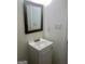 Bathroom with a new vanity, framed mirror, and updated fixtures, offering a modern touch at 103 Tiburon Ct, Stonecrest, GA 30038