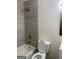 Updated bathroom with modern tile, a bathtub, and a shower head for a relaxing experience at 103 Tiburon Ct, Stonecrest, GA 30038
