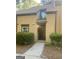Charming two-story townhouse featuring well-kept landscaping, and a inviting front entrance at 103 Tiburon Ct, Stonecrest, GA 30038