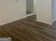 View of the hallway with wood flooring and white walls at 103 Tiburon Ct, Stonecrest, GA 30038