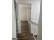 Hallway with hardwood floors leading into a bright room, showing good layout and design elements at 103 Tiburon Ct, Stonecrest, GA 30038