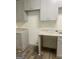 View of the kitchen featuring gray cabinets and gray counter tops at 103 Tiburon Ct, Stonecrest, GA 30038