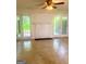 Living room featuring tiled flooring, a decorative fireplace, and double doors opening to the outside at 103 Tiburon Ct, Stonecrest, GA 30038