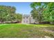 A spacious backyard featuring a lawn and a view of the home at 1070 Evergreen Oak Way, Dacula, GA 30019