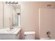 Bright bathroom featuring a tub and shower with white cabinets and sink at 1070 Evergreen Oak Way, Dacula, GA 30019