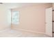 Neutral bedroom featuring a large window for natural light at 1070 Evergreen Oak Way, Dacula, GA 30019