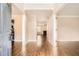 Welcoming entryway boasting hardwood floors and views into the living spaces featuring natural light at 1070 Evergreen Oak Way, Dacula, GA 30019