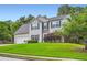 Charming two-story home featuring stone accents, manicured lawn, and an attached two-car garage at 1070 Evergreen Oak Way, Dacula, GA 30019