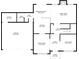 A detailed layout of the first floor, showcasing the kitchen, living spaces, garage, and utility areas at 1070 Evergreen Oak Way, Dacula, GA 30019