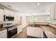 Kitchen with stainless appliances, granite counters, and white cabinets at 1070 Evergreen Oak Way, Dacula, GA 30019
