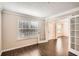 Bright living room featuring hardwood floors, a window, and French doors leading to other spaces at 1070 Evergreen Oak Way, Dacula, GA 30019