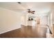 Open-concept living room featuring hardwood floors and access to kitchen at 1070 Evergreen Oak Way, Dacula, GA 30019