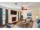 Inviting living room with fireplace, plush seating, and window views at 1070 Evergreen Oak Way, Dacula, GA 30019