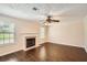 Spacious living room with hardwood floors, fireplace, and natural light at 1070 Evergreen Oak Way, Dacula, GA 30019