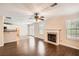 Hardwood living room featuring a fireplace and an open floorplan at 1070 Evergreen Oak Way, Dacula, GA 30019